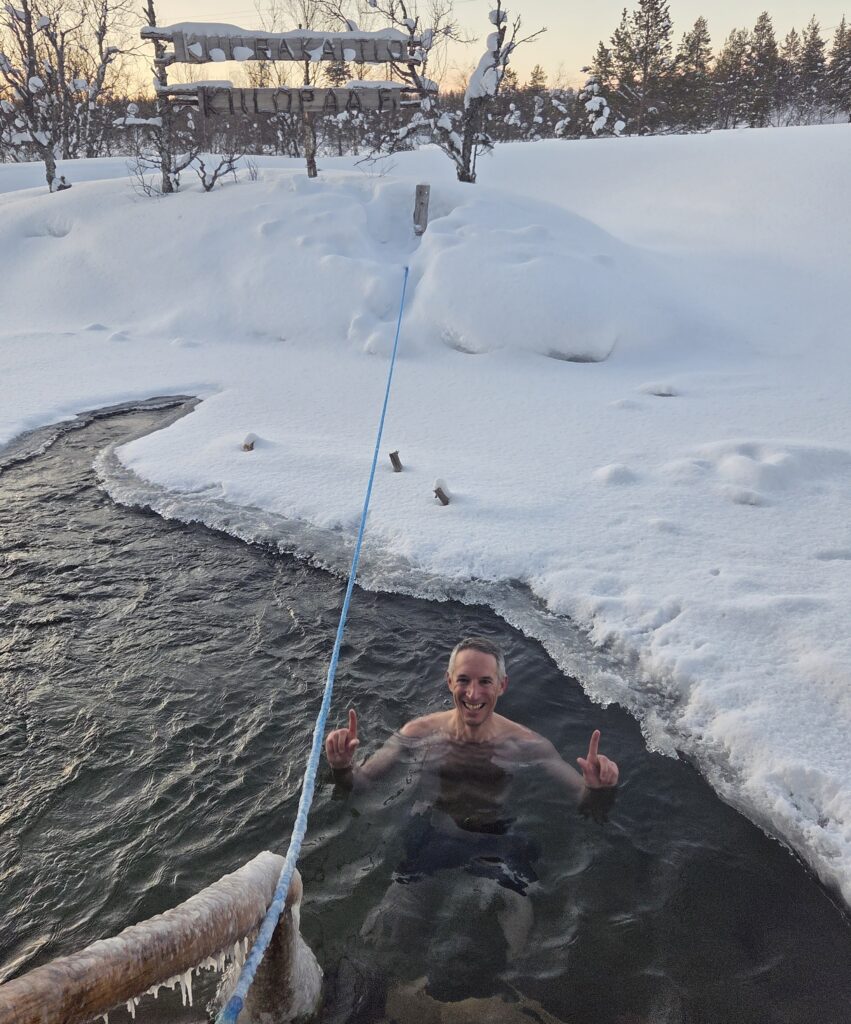 Miguel swimming in ice hole
